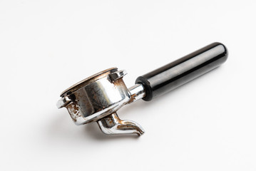 Coffee barista scoop or spoon machine full of ground coffee isolated