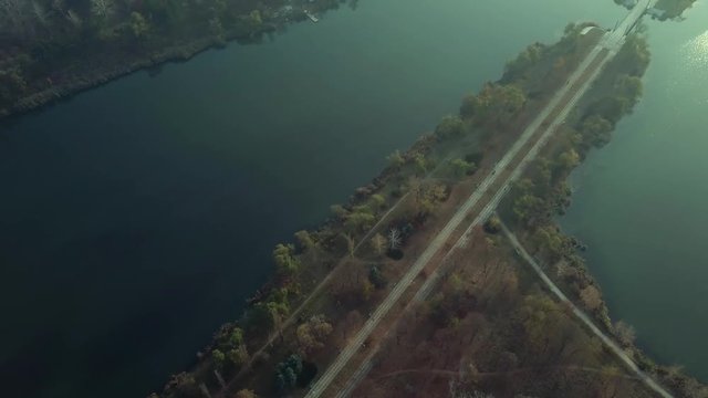 Aerial footage over Echo Park Lake, Kishinev, Moldova republic of. View of lake and smille bridge.