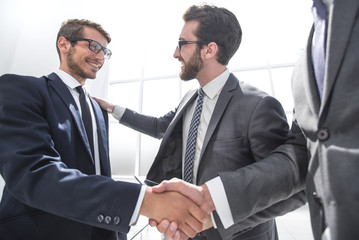 Fototapeta premium handshake business partners in a modern office