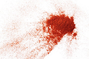 Pile of red paprika powder isolated on white background, top view