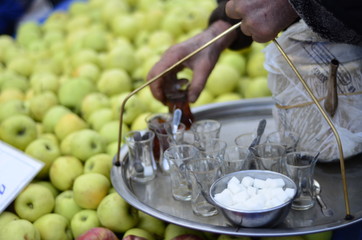 a tea maker prepare a turkish tea in the neighborhood market