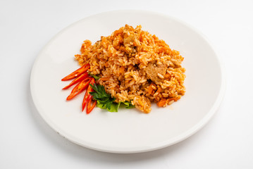 rice pilaf with meat, carrot and onion isolated on white background