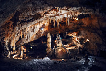 Stalagmites and stalactites in Lipa Cave, formations Columns and Draperies, Montenegro, Lipska Pecina - obrazy, fototapety, plakaty