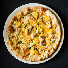 pizza on the black background
