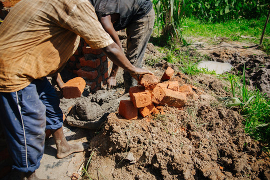 Man Building A House In Uganda, Africa