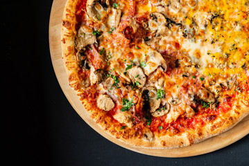 pizza on the black background