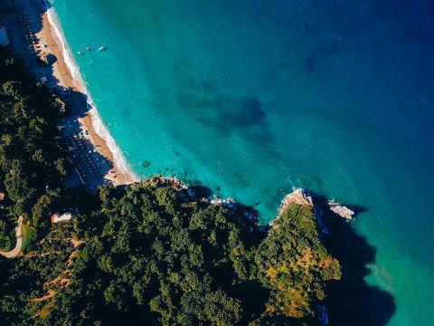 Drone top view of a sea cliff and a beach