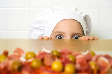 funny happy caucasian girl preparing pizzas to baking in kitchen  © GDM photo and video