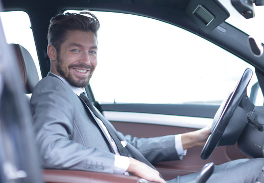 Handsome Businessman In The Drivers Seat In His Car