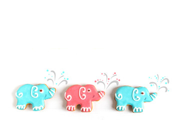 Photos of cars and elephants on a wooden background. Children banner. Frame for greeting card newborn boy. Blank for design childish banner with gingerbread.