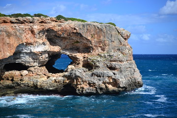 Rock formations for climbing at Cala Sa Nau beach and Cala d'Or city, Palma Mallorca Island, Spain