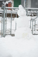 Little snowman, snowy winter in Kiev, Ukraine