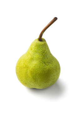 Juicy green packham pear on white with drops.