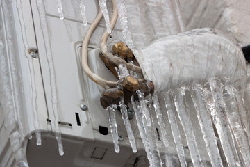 icicles hanging from the air conditioner close-up
