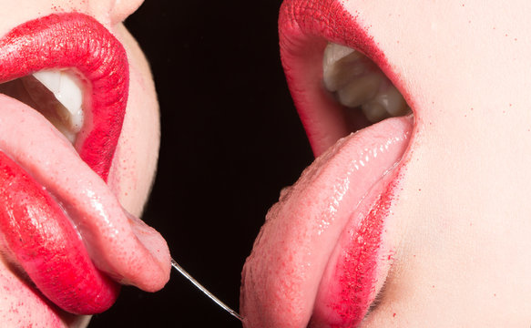 Seductive feminine tongue in mouth with saliva. 