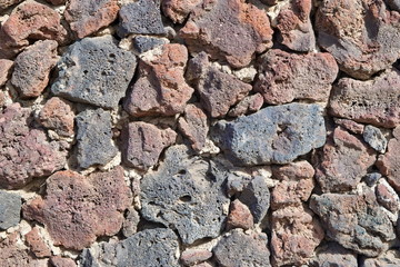 The decorative fence surface of volcanic lava.