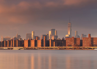Fototapeta premium View on Midtown Manhattan from east river at sunrise with long exposure