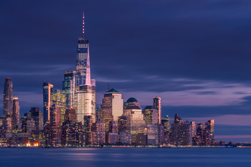 Fototapeta na wymiar Financial district view from hudson river at night with long exposure