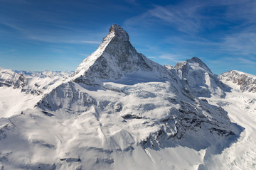Fototapeta na wymiar Aerial view of majestic Matterhorn mountain in front of a blue sky