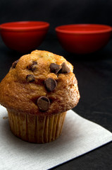 Close View of a Delicious Chocolate Chip Muffin on Dark Background