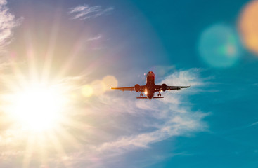 Passanger aircraft flying in sky, sunny clear weather