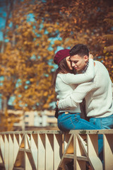 Fototapeta premium Girlfriend kissing her boyfriend in the park