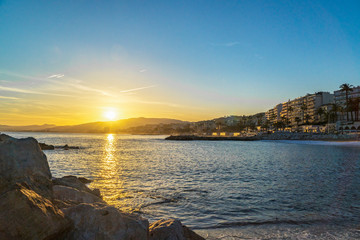 sunset on coast of sea