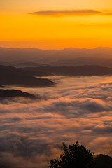  sunset overlooking mountains with Mist