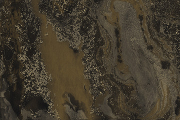 Luxury gold marble ink paper texture on dark watercolor background. Chaotic abstract organic design. Bath bomb waves.