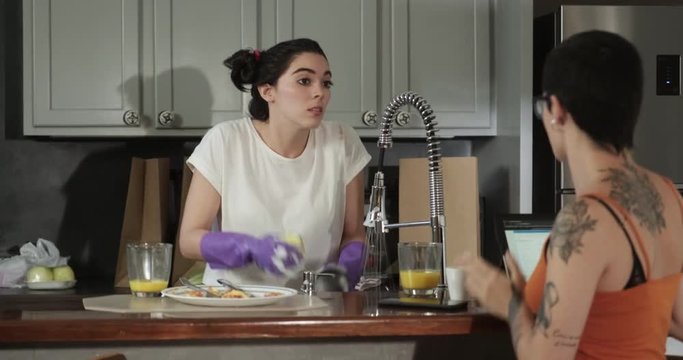 Lesbian Couple Having a Domestic Argument Over Dirty Dishes
