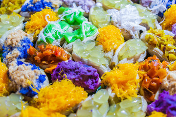 Fototapeta na wymiar A colorful of Thai sweets with boiled banana and multi topping.