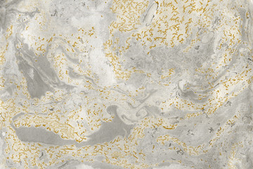 Luxury gold marble ink paper texture on dark watercolor background. Chaotic abstract organic design. Bath bomb waves.