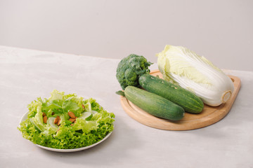 Various green organic salad ingredients on white background. Healthy lifestyle or detox diet food concept