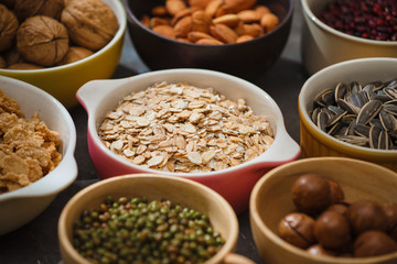 Different kinds of nuts in bowls.