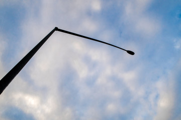 street lamp on blue cloudy sky