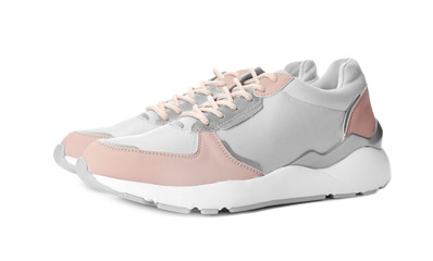 Pair of stylish sneakers on white background