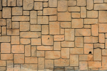 Masonry stone cladding wall texture. Geometric shapes surface background.