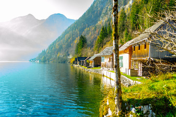 mountain village, on the bank of the lake, beautiful houses, on the background of high mountains, mountains covered with trees and pines, beautiful sky, beautiful nature, lake