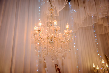 Chrystal chandelier lamp with white curtain