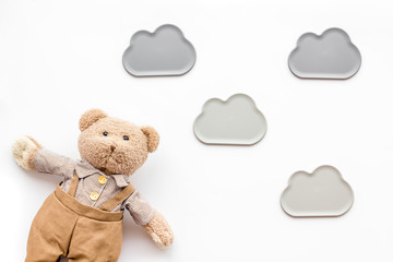 Handmade toys for newborn baby. Teddy bear. White background top view