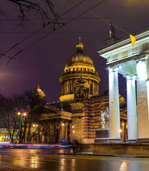 St. Isaac's Cathedral night, tracers from cars on the road in the foreground. Saint-Petersburg