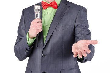 Presenter with radio microphone is talking a speech isolated on a white background.