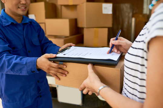 Woman signing document when receiving her package