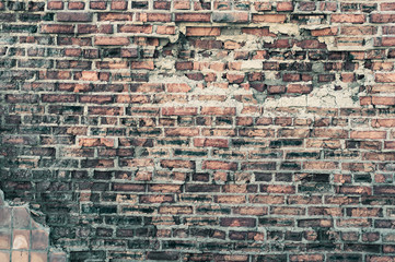Grunge old shabby red brick wall