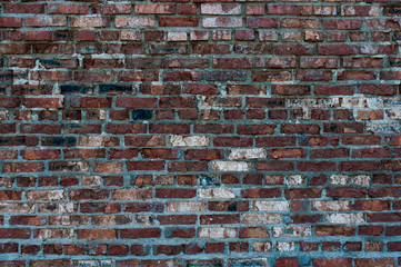 Texture of old brick wall with red cracked brick