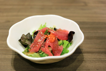 Fresh fin tuna salad. Raw tuna slices with vegetables. 