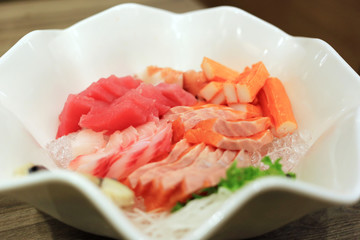 Sashimi bowl set such as salmon, mackerel, crab stick (Kanikama) and tuna delicious fresh raw fish japanese food.