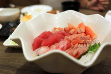 Sashimi bowl set such as salmon, mackerel, crab stick (Kanikama) and tuna delicious fresh raw fish japanese food.