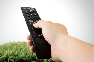 Hand with tv remote control