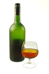 Bottle of brandy and a glass on a white background. Isolated on white